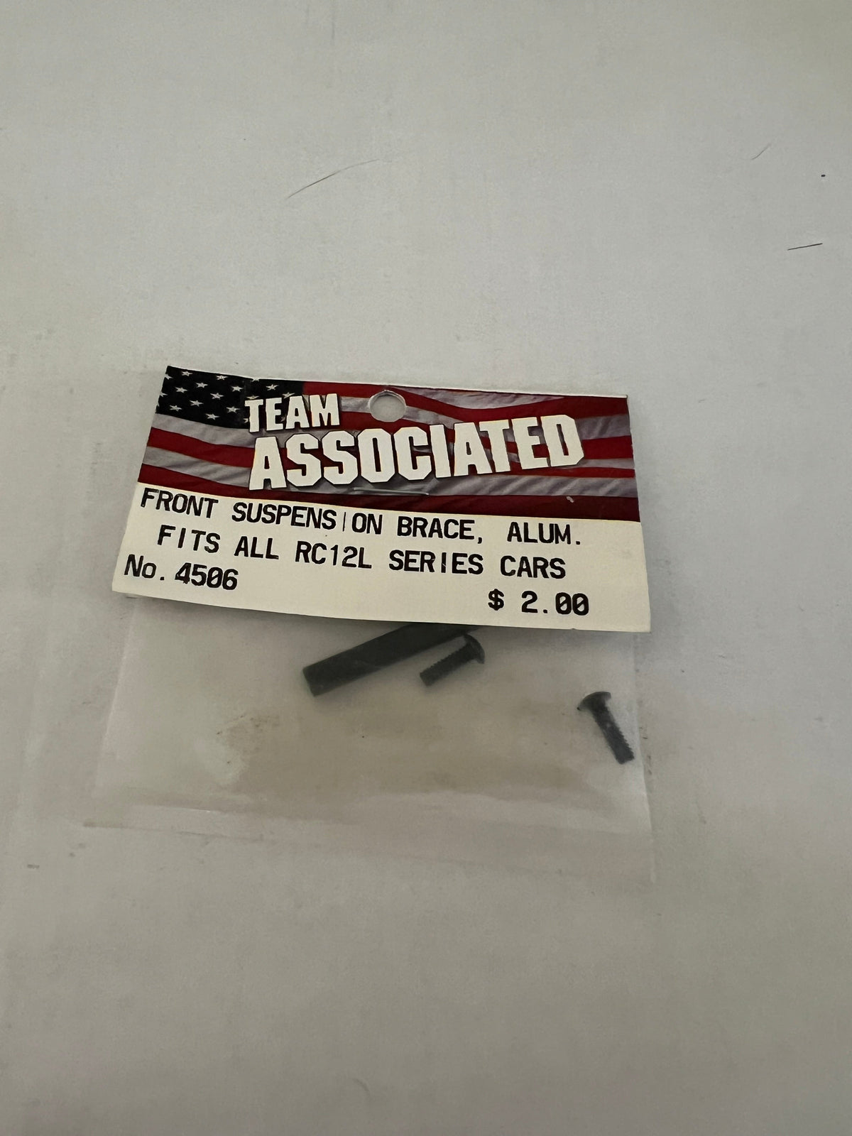 FRONT SUSPENSION BRACE, ALUM. FITS ALL RC12L SERIES CARS-ASC4506